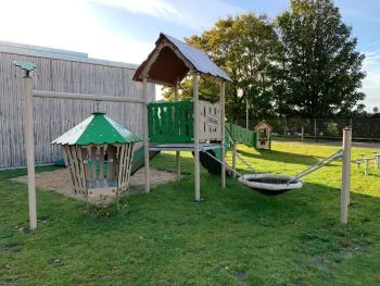 Hanok adventure play structure in a mixed playground